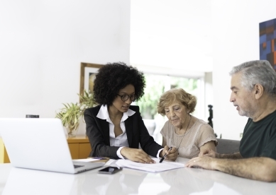 Senior Couple Meeting with Female Advisor